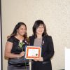 Marika Siewert receiving her Recognition of Excellence Award Arts and Culture from Senator Yonah